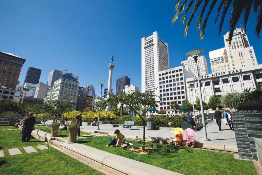 People enjoy a park in Union Square on a sunny day. San Francisco, California.